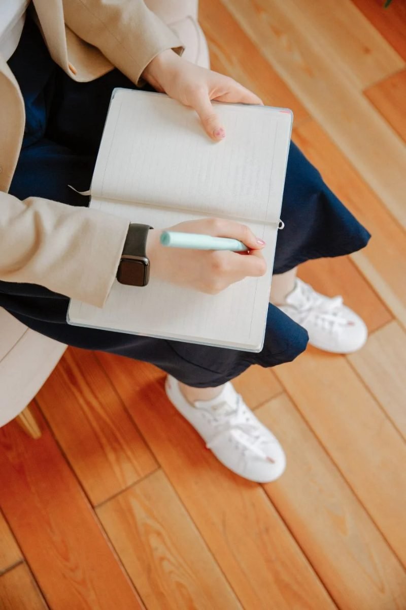 Person taking notes during a counselling session